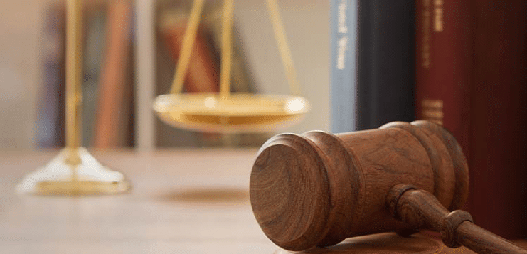 A gavel and a justice scale