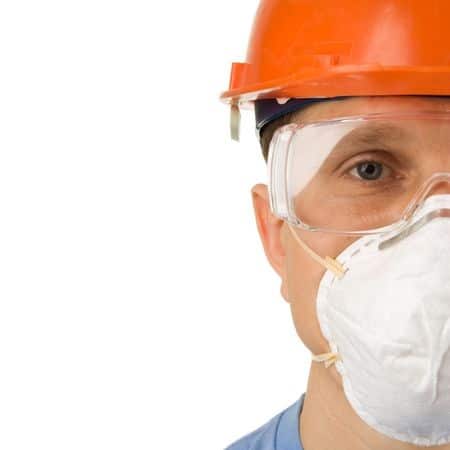 An man covering his nose with a cover