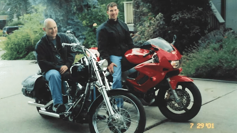 Two men on power bikes
