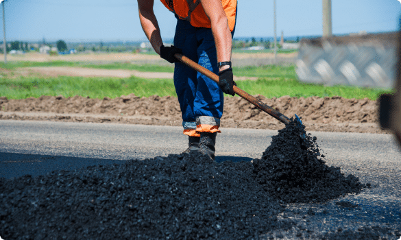 Man using the shovel to work with asbestos exposure