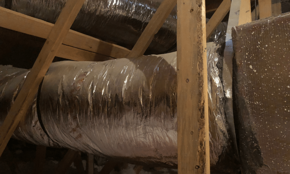 air ducts in attic with insulating wrapping