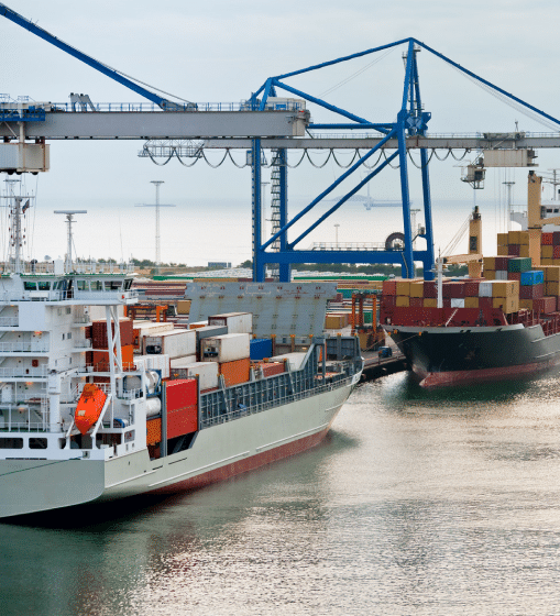 sideview of a cargo ship in a shipyard