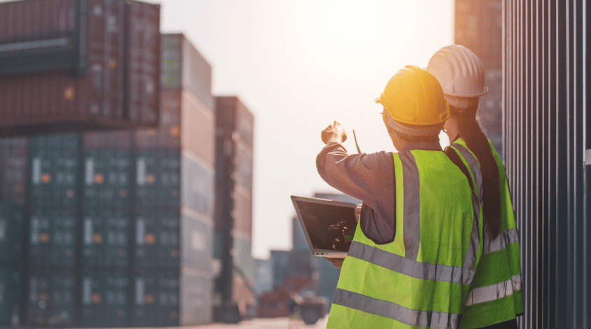 longshore workers inspecting shipping containers